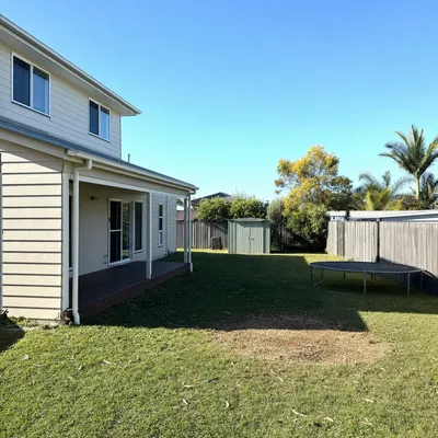 After: Camphor laurel craned out over a unit block, Parramatta
